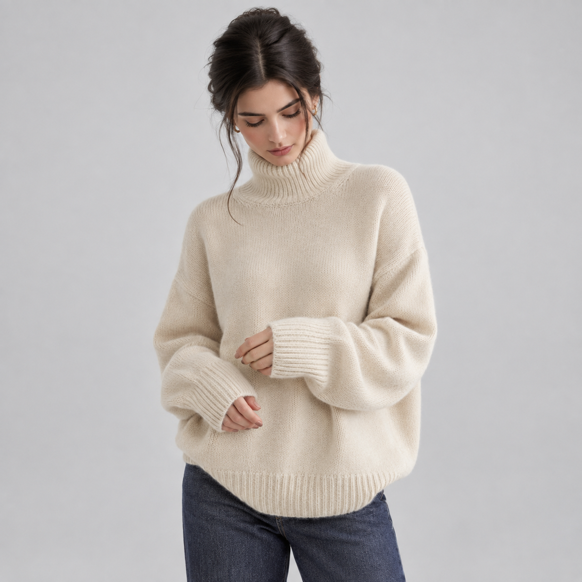 Women's Oversized Turtleneck Knit Sweater on a model, front detail