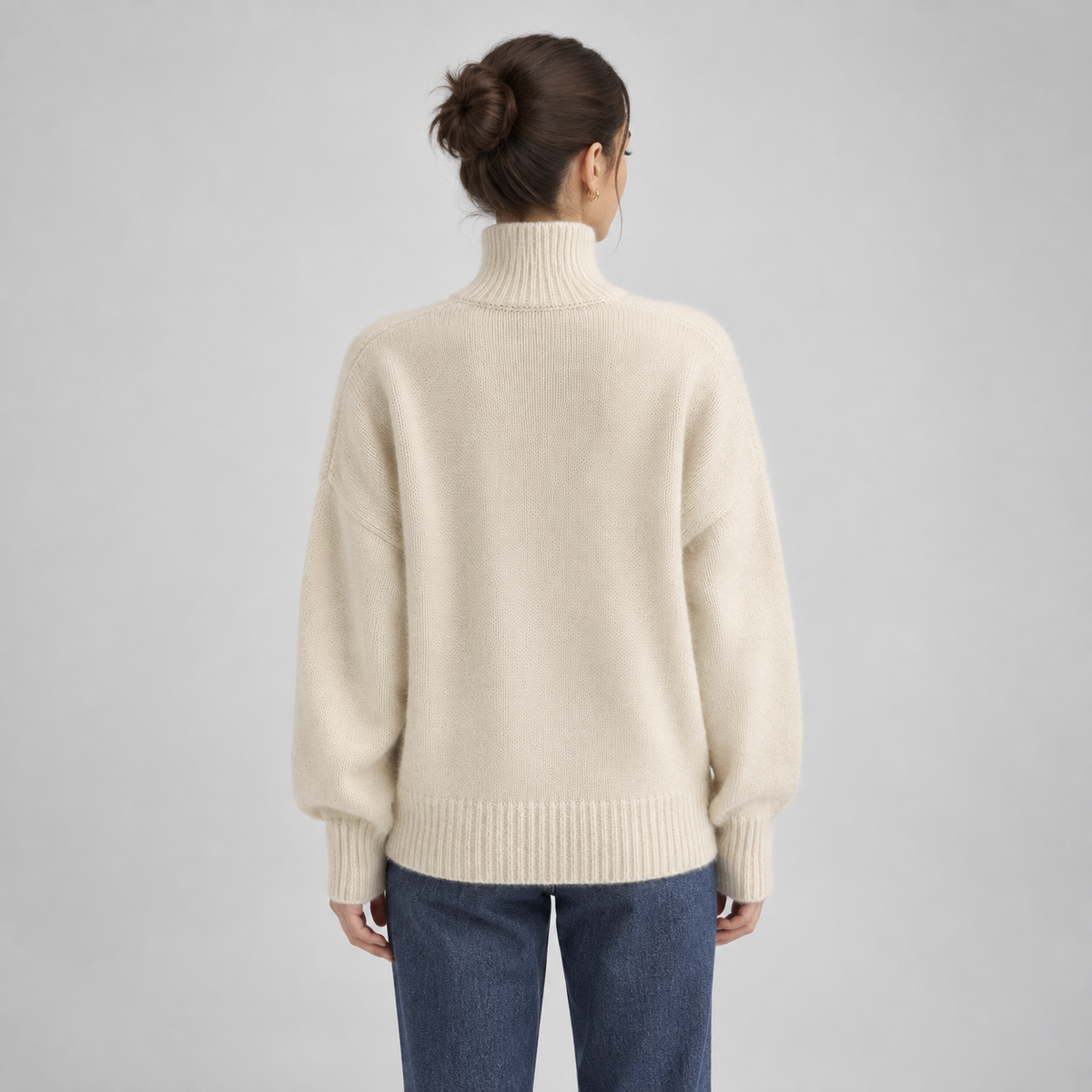 Women's Oversized Turtleneck Knit Sweater on a model, back view