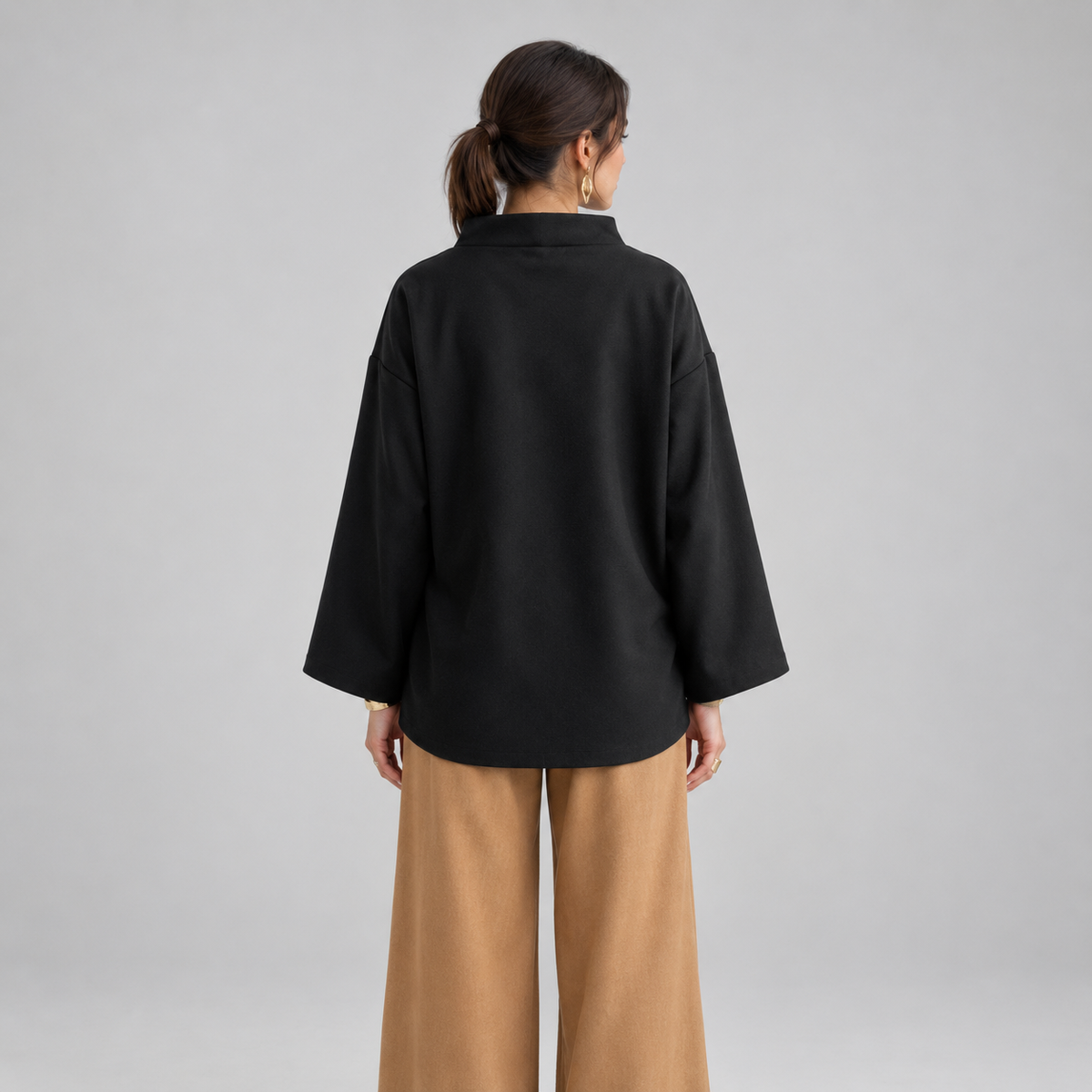 Women's Oversized Mock-Neck Knit Sweater Top on a model, back view