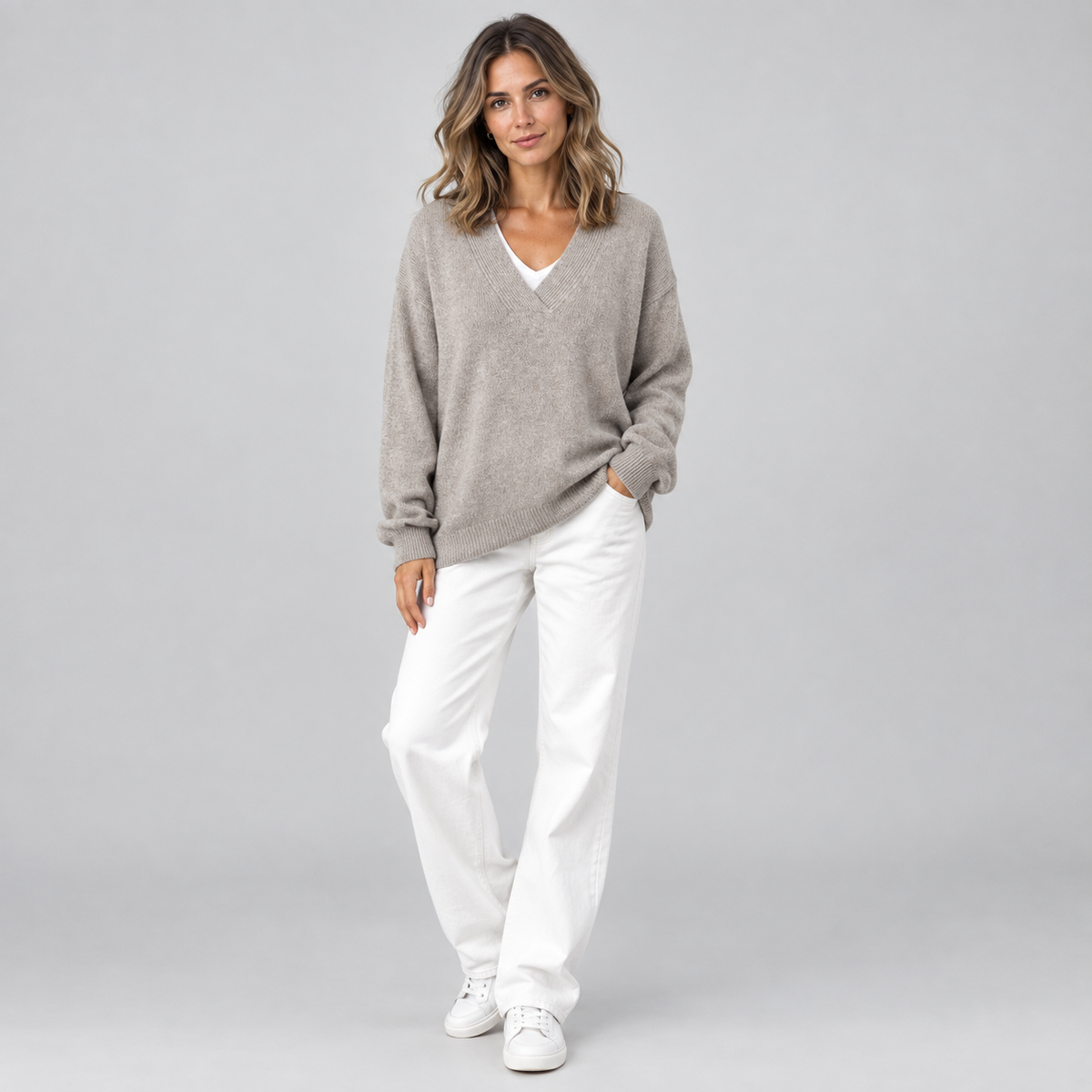 Women's Oversized V-Neck Knit Sweater on a model, front view