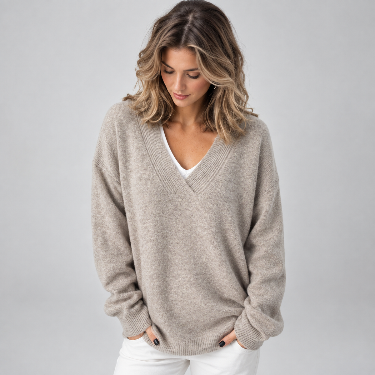 Women's Oversized V-Neck Knit Sweater on a model, front detail