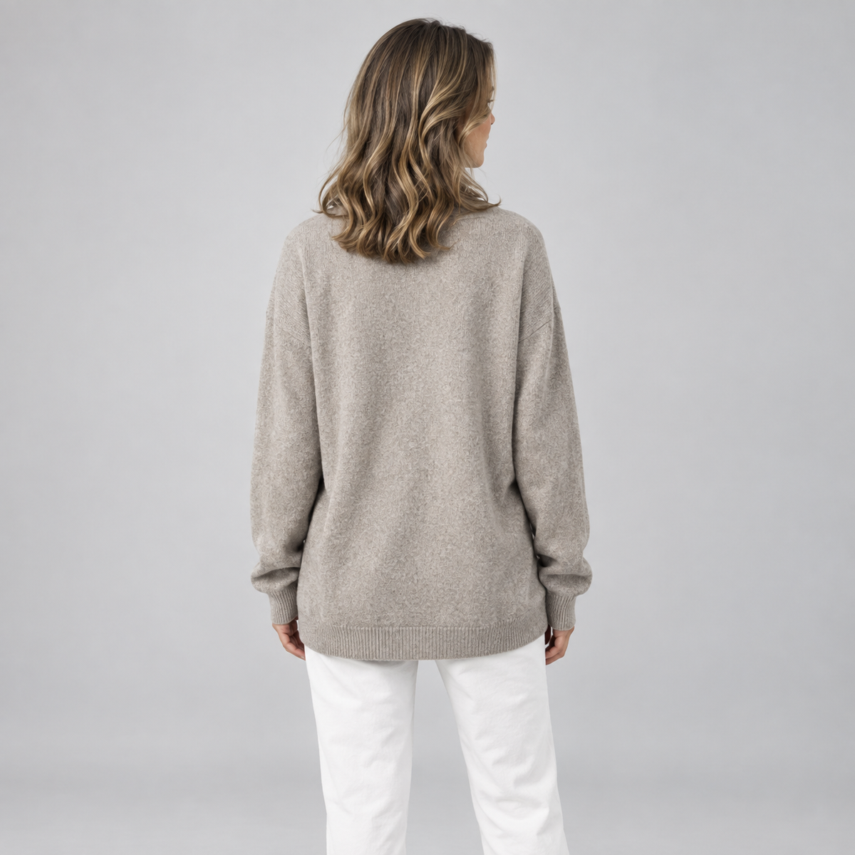 Women's Oversized V-Neck Knit Sweater on a model, back view