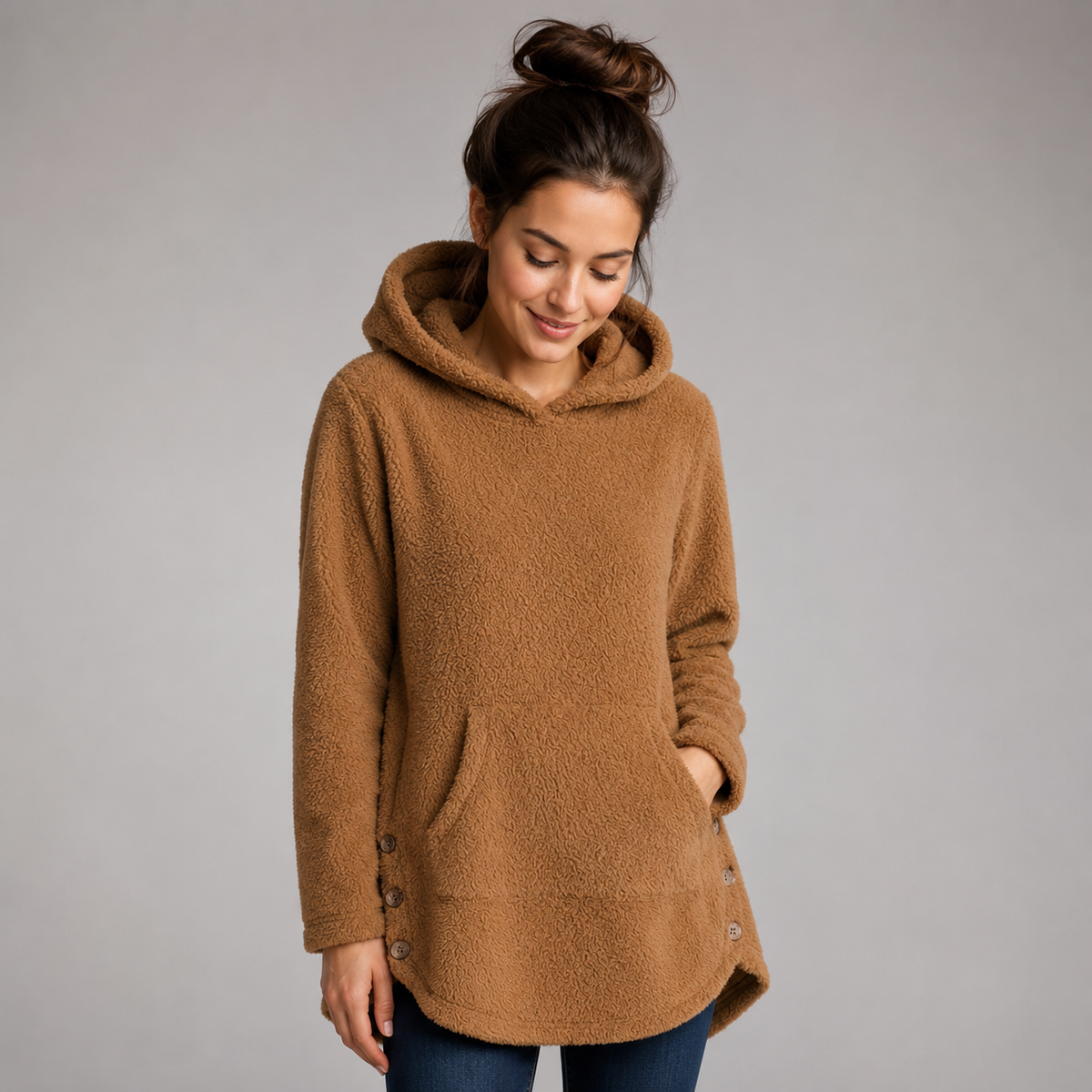 Women's hooded fleece pullover on a model, front detail
