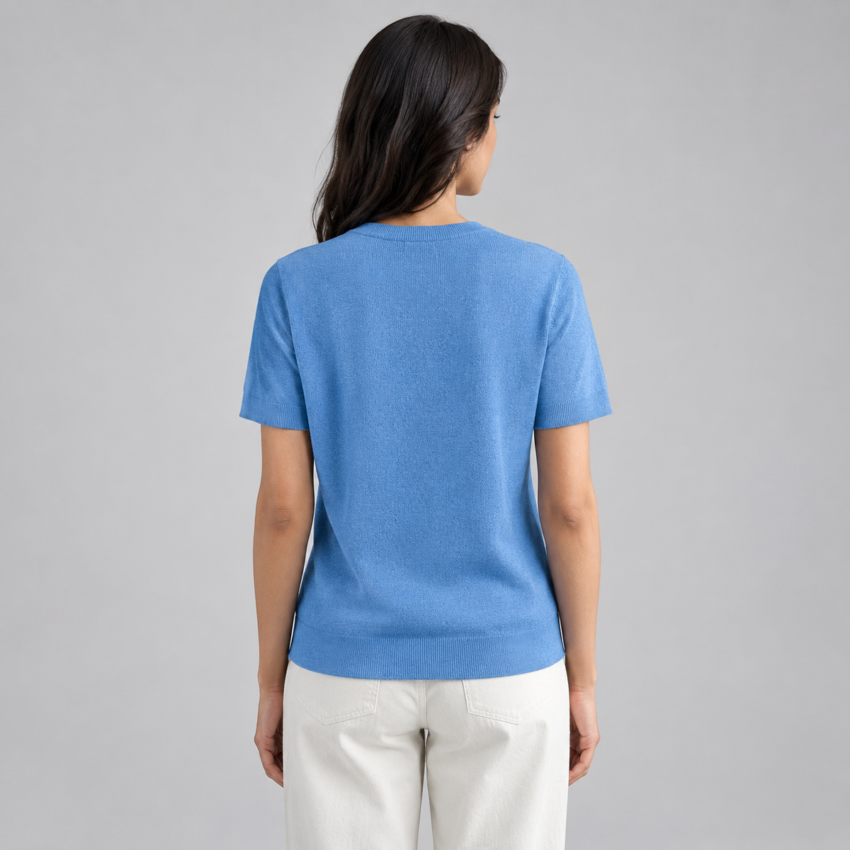 Women’s Relaxed Fit Short Sleeve Knit Sweater Top on a model, back view