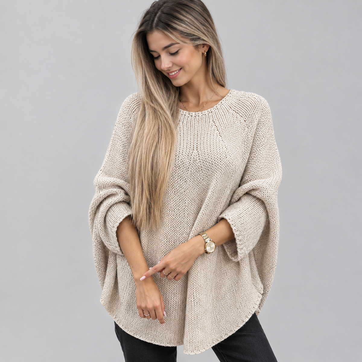 Women’s Oversized Batwing-Sleeve Knit Sweater on a model, front detail